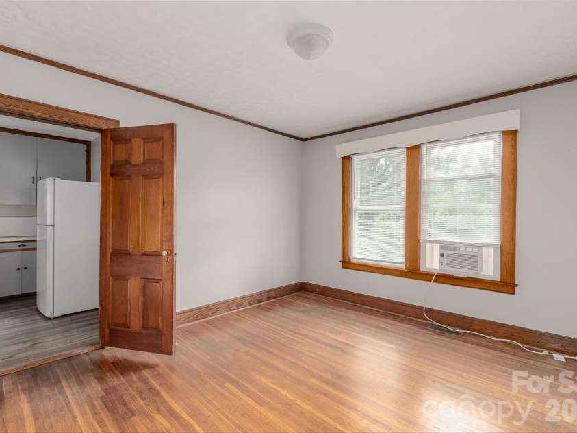 46 Gilkey Street, Marion, NC 28752.  MLS# CAR4396879, YatesRealty ID 33112. Large dining room between living room and kitchen.