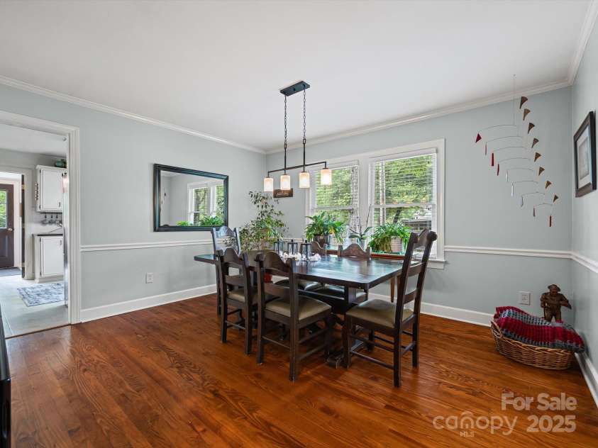 4065 Mountainview Street, Gastonia, NC 28056.  MLS# CAR4290116, YatesRealty ID 33115. Formal dining area from the FR, kitchen  on the left. The wood floors are original and in pristine condition!