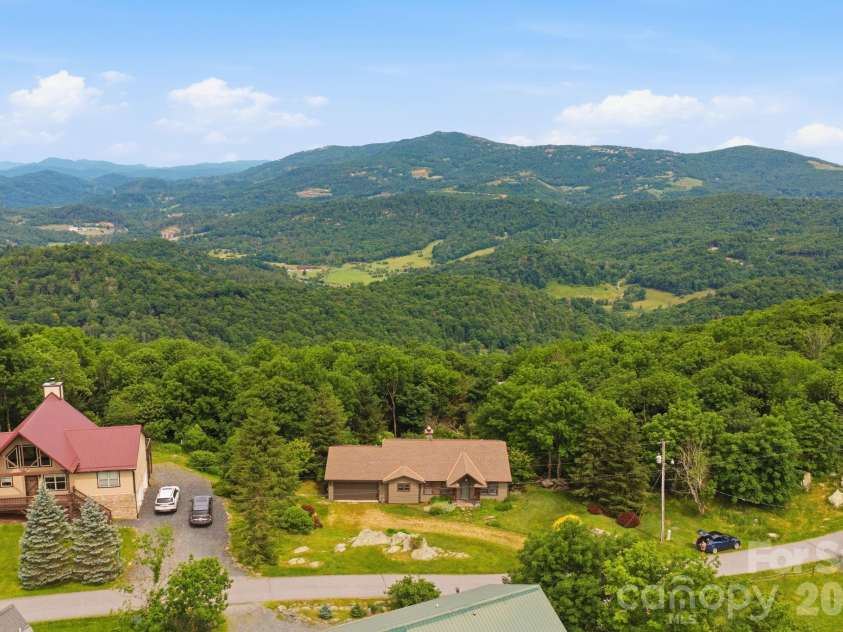 276 Four Diamond Drive, Seven Devils, NC 28604.  MLS# CAR4394348, YatesRealty ID 33119. Aerial view with Beech Mtn in the distance