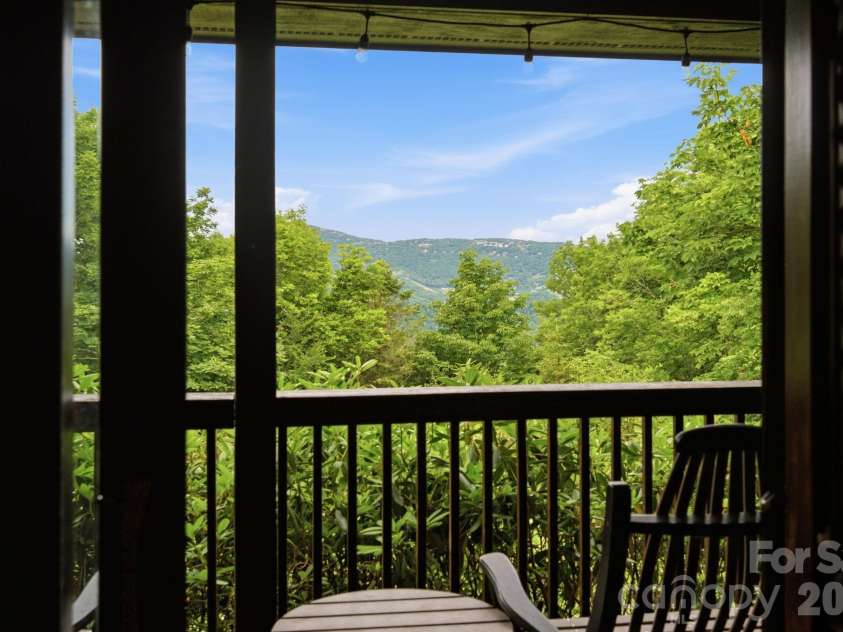 276 Four Diamond Drive, Seven Devils, NC 28604.  MLS# CAR4394348, YatesRealty ID 33119. Summer view from covered deck of Beech Mtn.