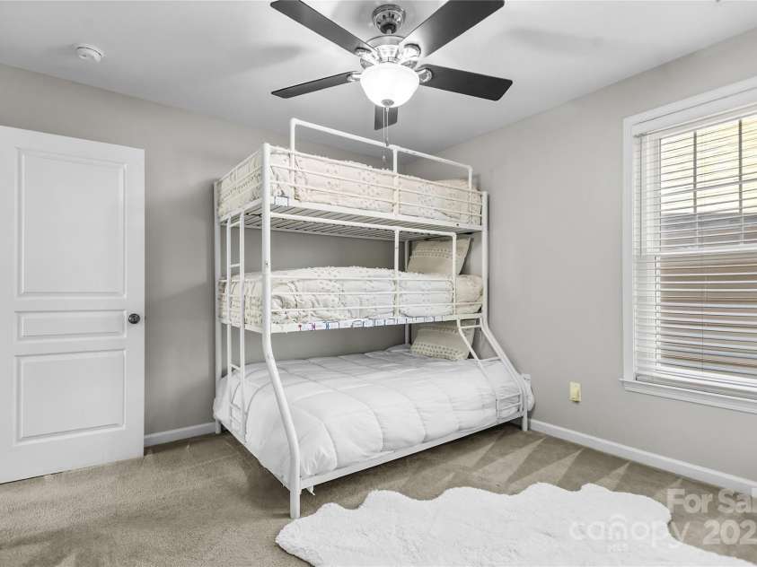 9724 Cadman Court, Cornelius, NC 28031.  MLS# CAR4233696, YatesRealty ID 3312. Bedroom 3 weith ceiling fan/light!