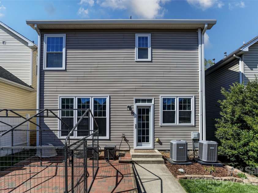 9724 Cadman Court, Cornelius, NC 28031.  MLS# CAR4233696, YatesRealty ID 3312. Exterior Back of Home with brick patio!