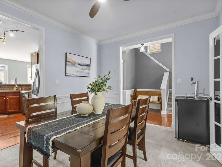 9724 Cadman Court, Cornelius, NC 28031.  MLS# CAR4233696, YatesRealty ID 3312. Formal Dining Room with wainscoting, crown molding & French doors to Office!
