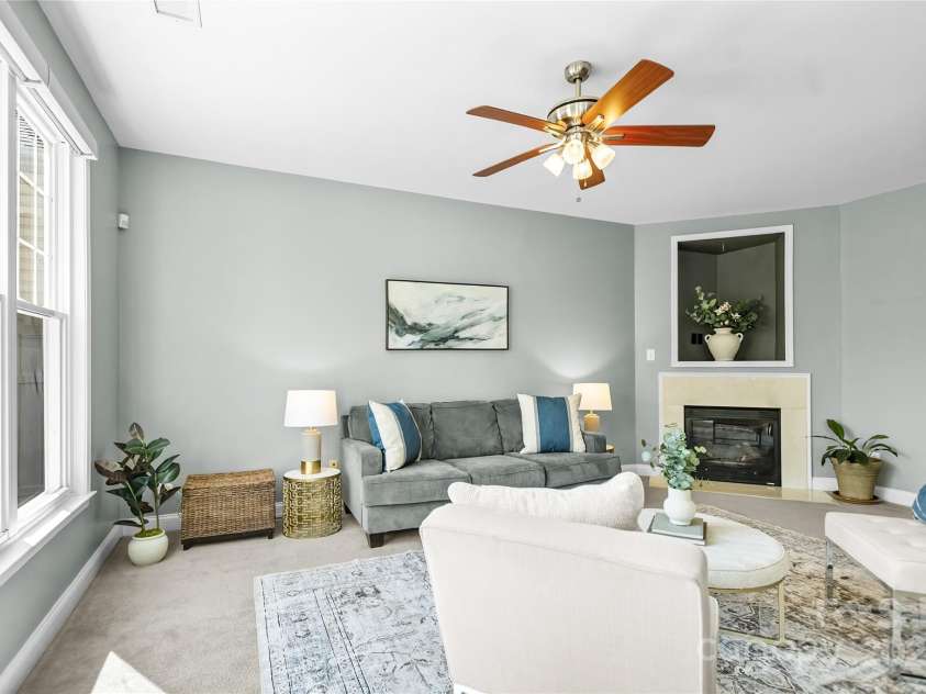 9724 Cadman Court, Cornelius, NC 28031.  MLS# CAR4233696, YatesRealty ID 3312. Great Room with gas fireplace, ceiling fan/light & tons of natural light!