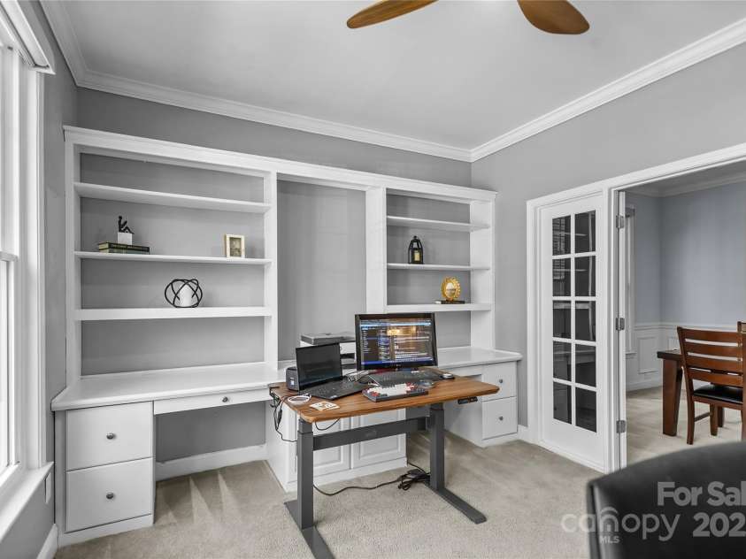 9724 Cadman Court, Cornelius, NC 28031.  MLS# CAR4233696, YatesRealty ID 3312. Office with Built ins, ceiling fan/light, crown molding, French Doors & great natural light!