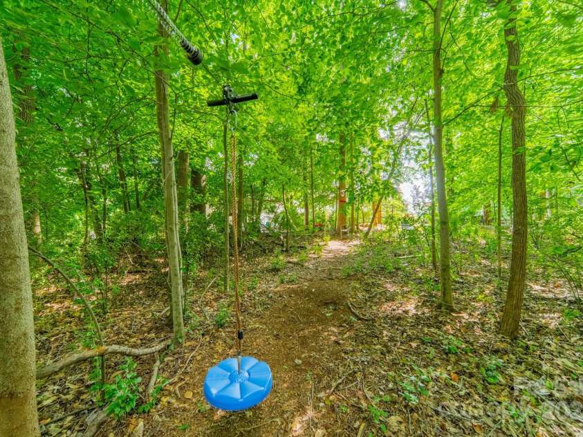 5804 Dinsmore Lane, Belmont, NC 28012.  MLS# CAR4264169, YatesRealty ID 33124. Zip line area in woods