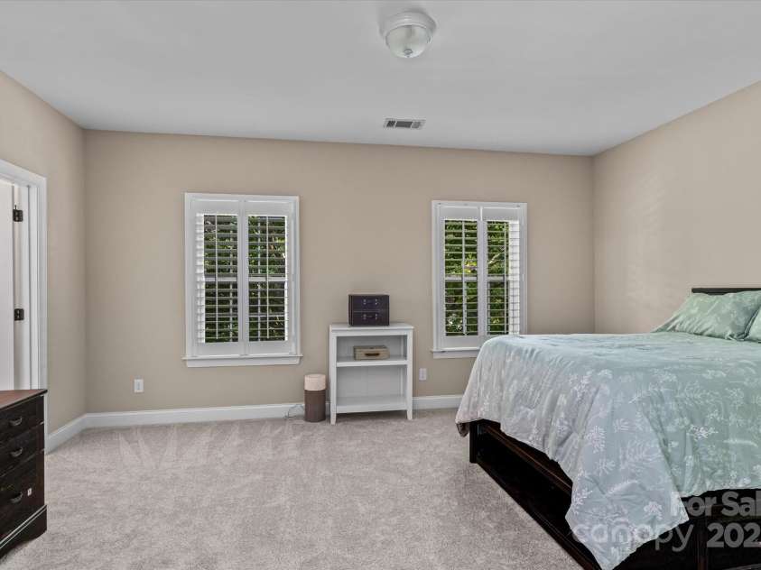 1040 Lake Forest Drive, Matthews, NC 28104.  MLS# CAR4285953, YatesRealty ID 33125. Bedroom 2 on Upper Level with En Suite Bath