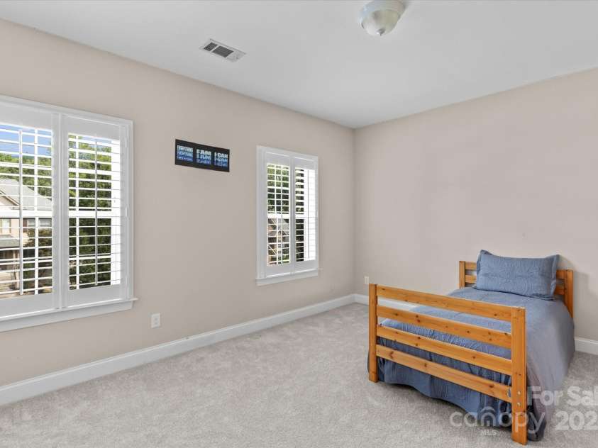 1040 Lake Forest Drive, Matthews, NC 28104.  MLS# CAR4285953, YatesRealty ID 33125. Bedroom 3 on Upper Level with Shared Bathroom