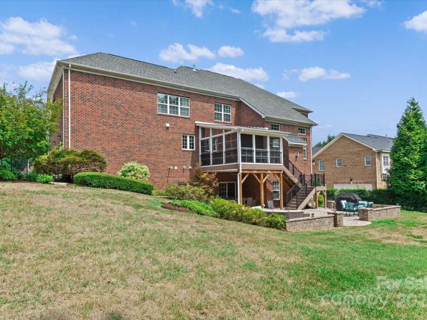 1040 Lake Forest Drive, Matthews, NC 28104.  MLS# CAR4285953, YatesRealty ID 33125. Exterior Rear Left