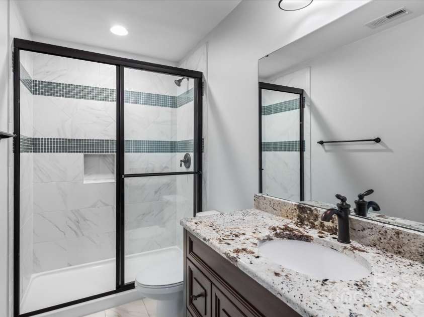 1040 Lake Forest Drive, Matthews, NC 28104.  MLS# CAR4285953, YatesRealty ID 33125. Full Bathroom in Basement