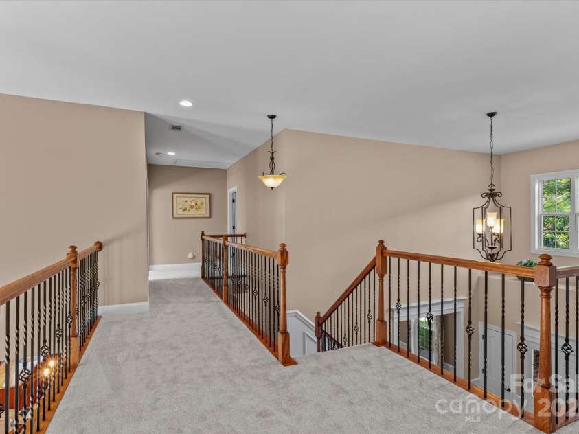 1040 Lake Forest Drive, Matthews, NC 28104.  MLS# CAR4285953, YatesRealty ID 33125. Upper Level Landing Bridge with view of Entryway and Two Story Great Room