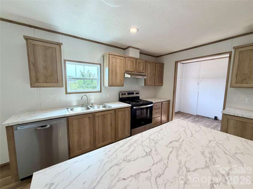 146 Con Lee Drive, Olin, NC 28660.  MLS# CAR4397827, YatesRealty ID 33129. KITCHEN