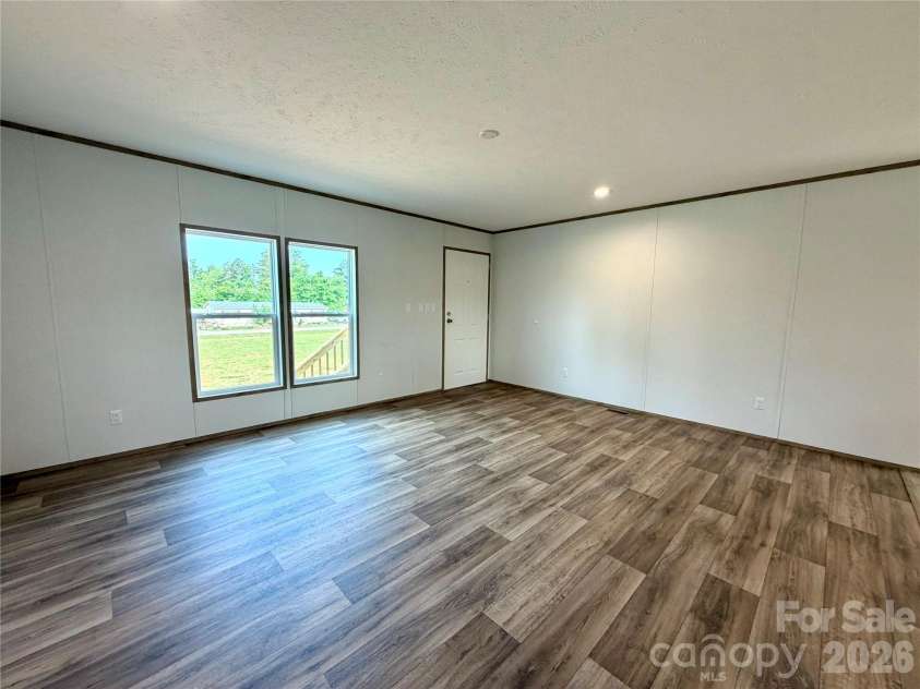 146 Con Lee Drive, Olin, NC 28660.  MLS# CAR4397827, YatesRealty ID 33129. LIVING ROOM