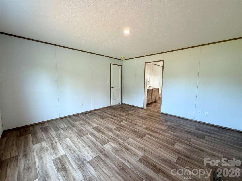 146 Con Lee Drive, Olin, NC 28660.  MLS# CAR4397827, YatesRealty ID 33129. PRIMARY BEDROOM