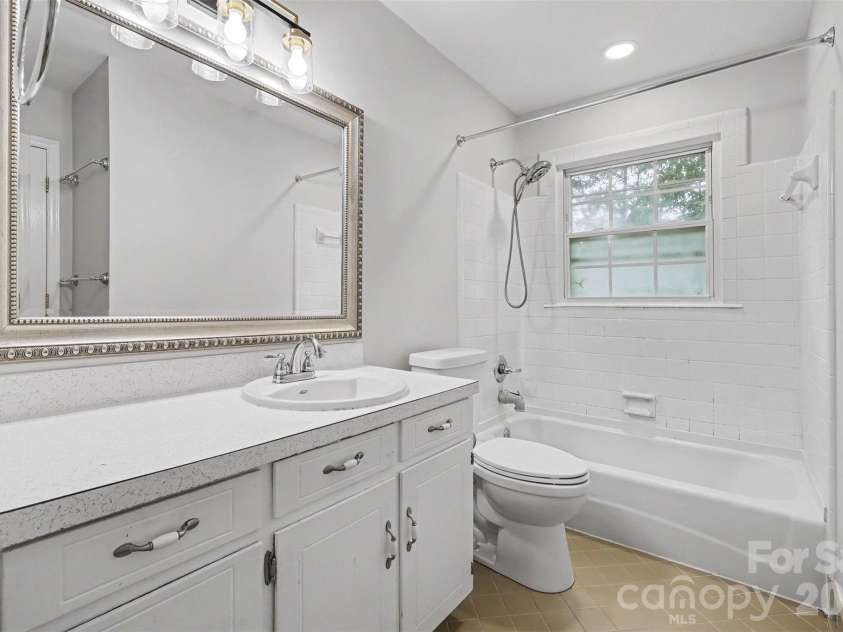 1030 Mclaughlin Drive, Charlotte, NC 28212.  MLS# CAR4393613, YatesRealty ID 33132. Upstairs Bathroom
