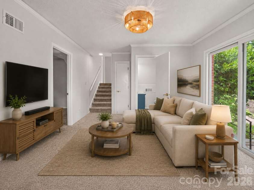 1030 Mclaughlin Drive, Charlotte, NC 28212.  MLS# CAR4393613, YatesRealty ID 33132. Virtually staged lower family room