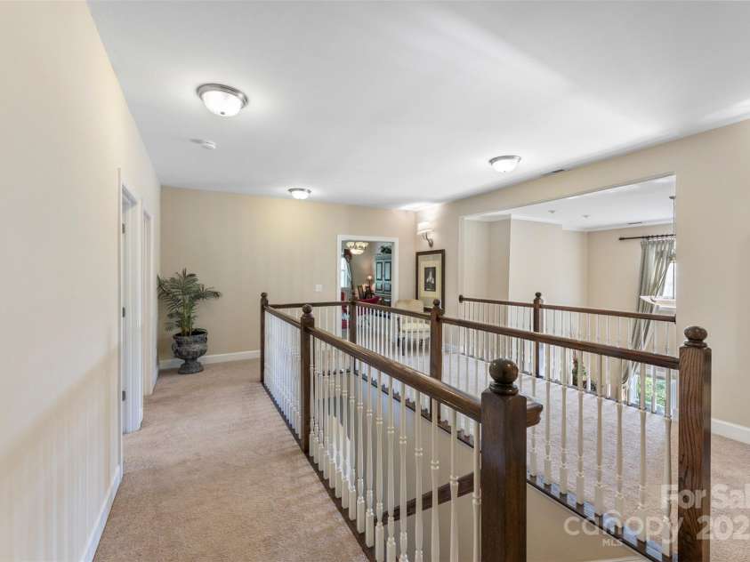1204 Vaugelas Court, Monroe, NC 28110.  MLS# CAR4280337, YatesRealty ID 33134. Expansive upstairs landing with open views to the living room below.
