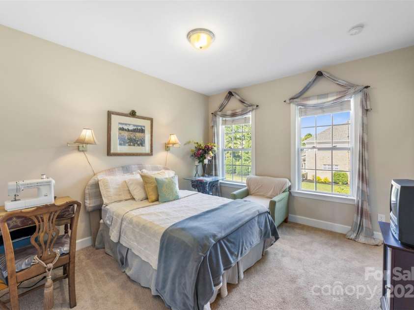 1204 Vaugelas Court, Monroe, NC 28110.  MLS# CAR4280337, YatesRealty ID 33134. Sunlit bedroom offers flexible use—guest retreat, nursery, or hobby room with the ensuite bath.