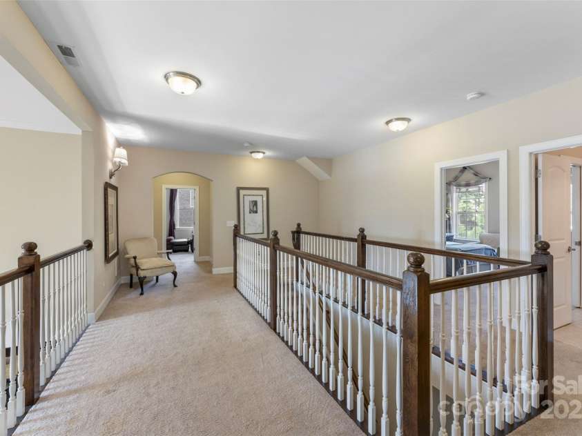 1204 Vaugelas Court, Monroe, NC 28110.  MLS# CAR4280337, YatesRealty ID 33134. The perfect perch to keep an eye on the action below while enjoying your own cozy retreat upstairs.
