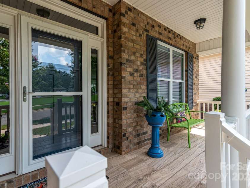 11728 Mount Argus Drive, Cornelius, NC 28031.  MLS# CAR4291411, YatesRealty ID 33139. Travertine stone front porch!