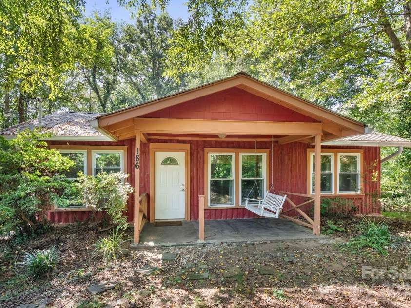 186 Pisgah View Road, Asheville, NC 28806.  MLS# CAR4293363, YatesRealty ID 33142. Porch swing front porch
