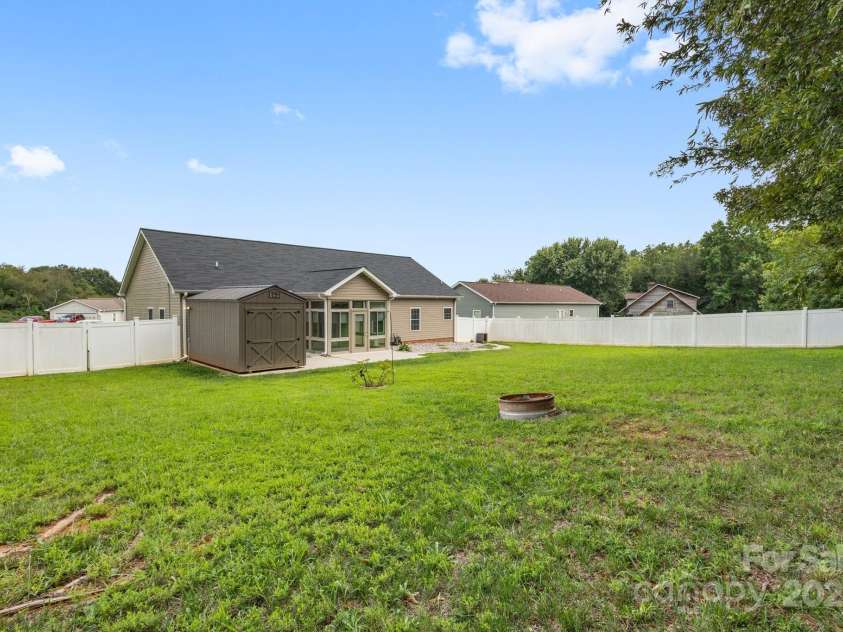 129 Sara Lane, Statesville, NC 28625.  MLS# CAR4293422, YatesRealty ID 33153. Fenced in Yard with Wired Outbuilding and concrete patio