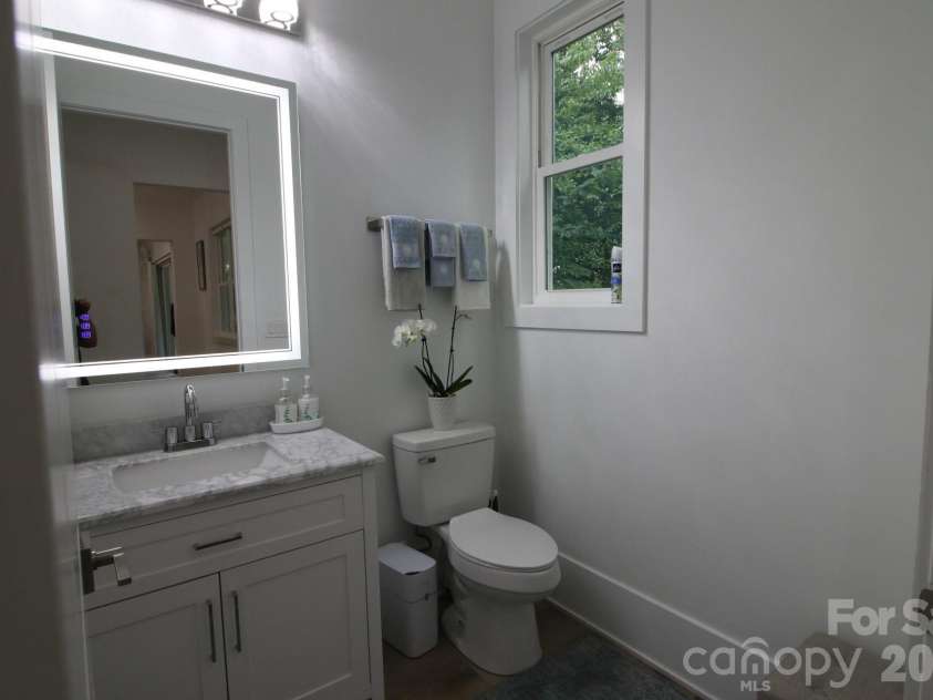 2916 Margaret Wallace Road, Matthews, NC 28105.  MLS# CAR4398220, YatesRealty ID 33157. Half bathroom