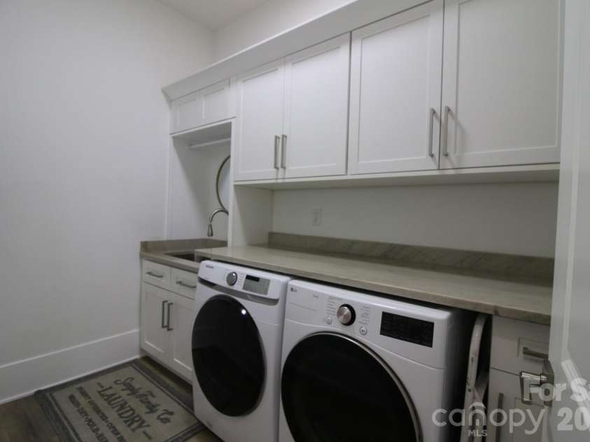 2916 Margaret Wallace Road, Matthews, NC 28105.  MLS# CAR4398220, YatesRealty ID 33157. Laundry room