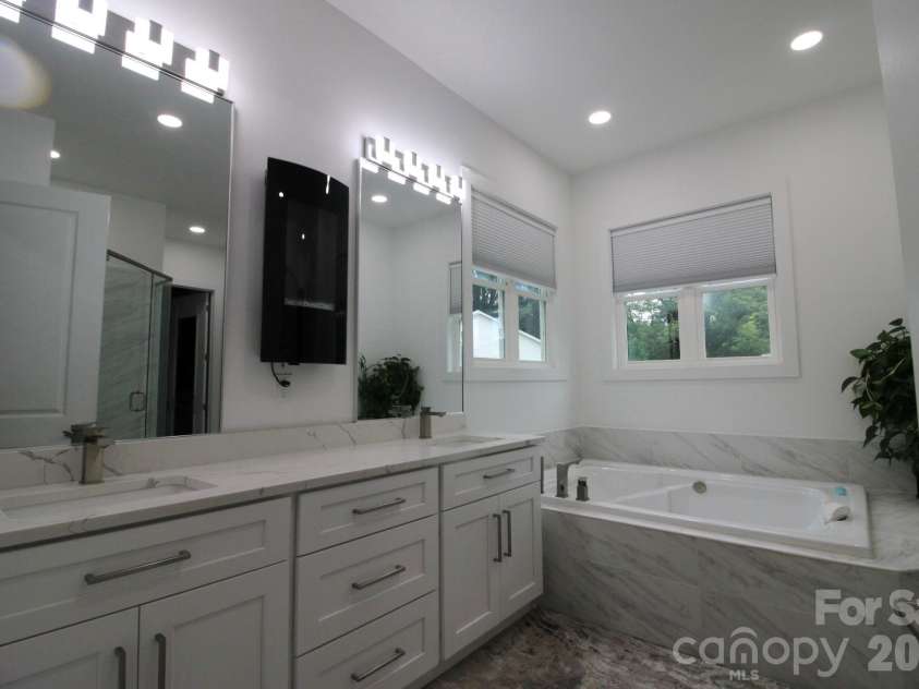 2916 Margaret Wallace Road, Matthews, NC 28105.  MLS# CAR4398220, YatesRealty ID 33157. Master bathroom