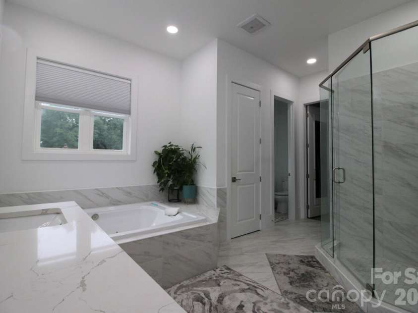 2916 Margaret Wallace Road, Matthews, NC 28105.  MLS# CAR4398220, YatesRealty ID 33157. Master bathroom