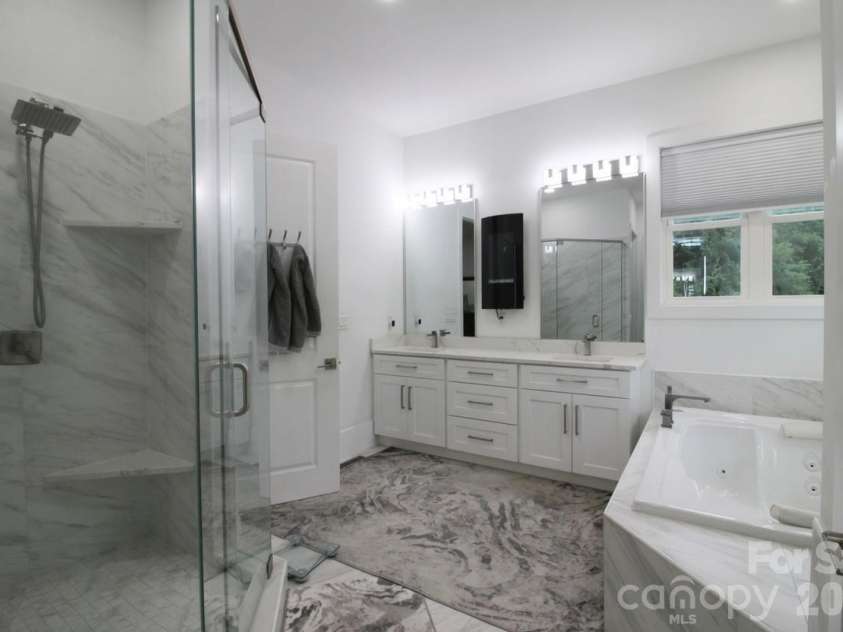 2916 Margaret Wallace Road, Matthews, NC 28105.  MLS# CAR4398220, YatesRealty ID 33157. Master bathroom