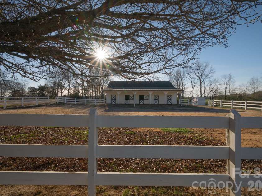 5432 Highway 218 Highway, Monroe, NC 28110.  MLS# CAR4340240, YatesRealty ID 3316. Barn paddock doubles as a riding area