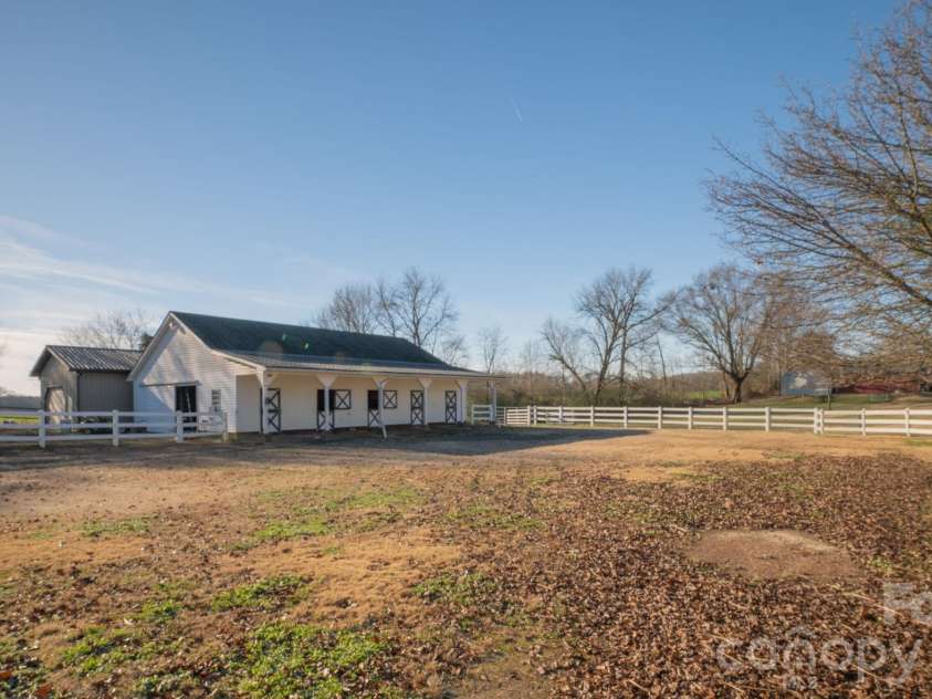 5432 Highway 218 Highway, Monroe, NC 28110.  MLS# CAR4340240, YatesRealty ID 3316. Detached garage placed behind the barn for aesthetics
