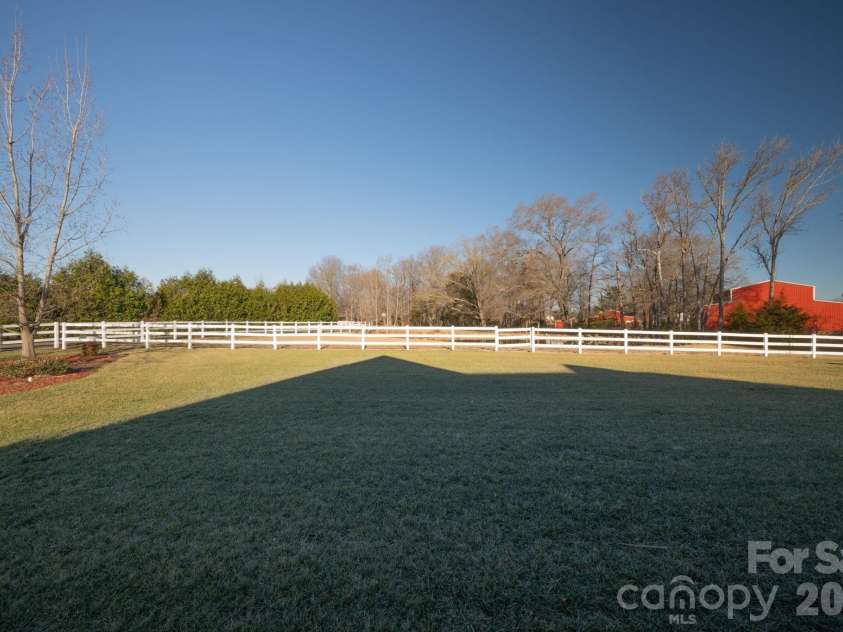 5432 Highway 218 Highway, Monroe, NC 28110.  MLS# CAR4340240, YatesRealty ID 3316. Front yard with tasteful and mature landscaping including hydrangeas, river birches and hollies