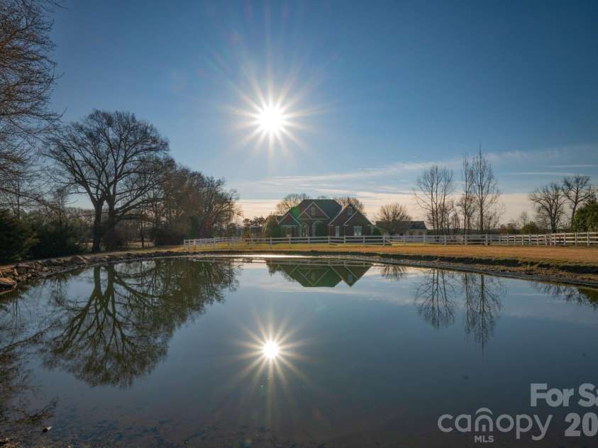 5432 Highway 218 Highway, Monroe, NC 28110.  MLS# CAR4340240, YatesRealty ID 3316. Picturesque pond ready for visiting ducks, turtle and frogs