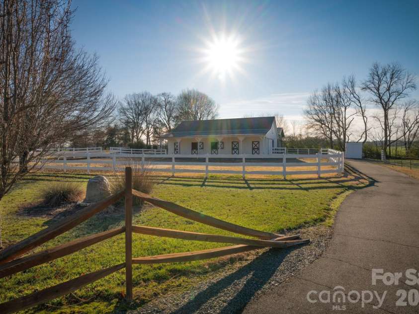 5432 Highway 218 Highway, Monroe, NC 28110.  MLS# CAR4340240, YatesRealty ID 3316. Stalls with dutch doors that open to overhand and paddock