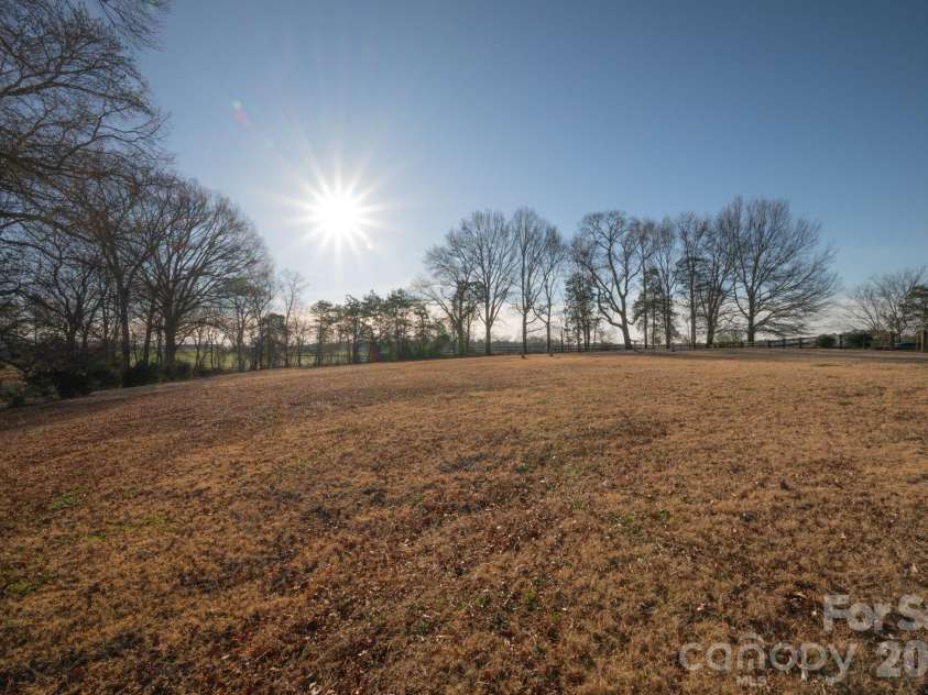 5432 Highway 218 Highway, Monroe, NC 28110.  MLS# CAR4340240, YatesRealty ID 3316. Tree lined pasture