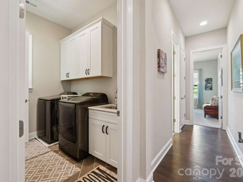 17914 Culross Lane, Charlotte, NC 28278.  MLS# CAR4366954, YatesRealty ID 33166. Walk thru laundry from hall to primary bath