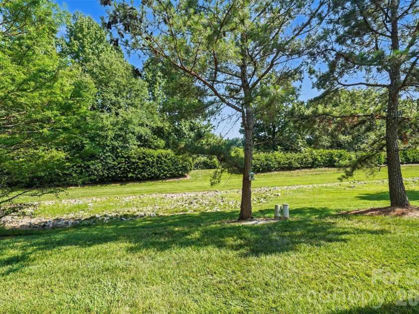 605 Gelderland Drive, Matthews, NC 28104.  MLS# CAR4395993, YatesRealty ID 33170. Backyard view