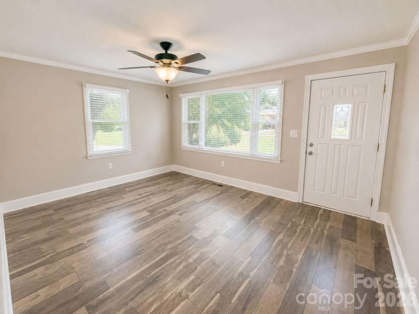 203 Danita Drive, Locust, NC 28097.  MLS# CAR4393303, YatesRealty ID 33174. Front room living space.