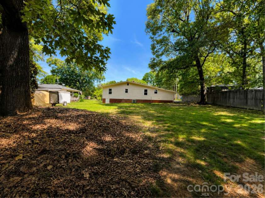 203 Danita Drive, Locust, NC 28097.  MLS# CAR4393303, YatesRealty ID 33174. Great mature trees.