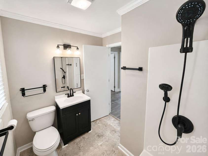 203 Danita Drive, Locust, NC 28097.  MLS# CAR4393303, YatesRealty ID 33174. Updated bathroom.