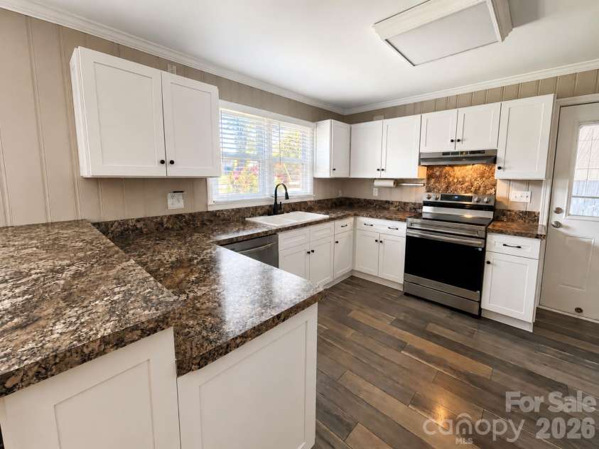 203 Danita Drive, Locust, NC 28097.  MLS# CAR4393303, YatesRealty ID 33174. Updated cabinets and natural light.