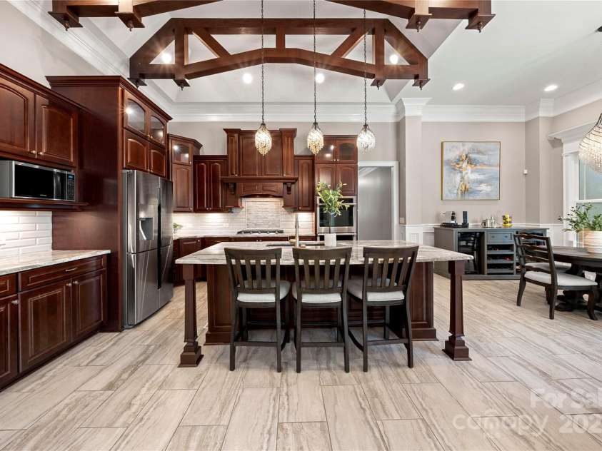 650 Top Ridge Lane, Clover, SC 29710.  MLS# CAR4280257, YatesRealty ID 33174. Chef's kitchen with decorative wood truss beams
