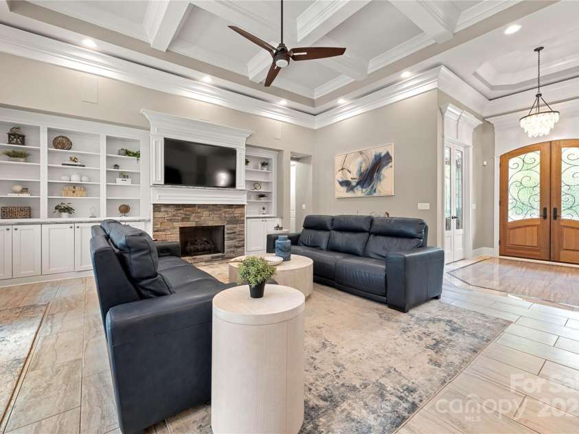 650 Top Ridge Lane, Clover, SC 29710.  MLS# CAR4280257, YatesRealty ID 33174. Large family room with porcelain tile, custom built ins and coffered ceilings