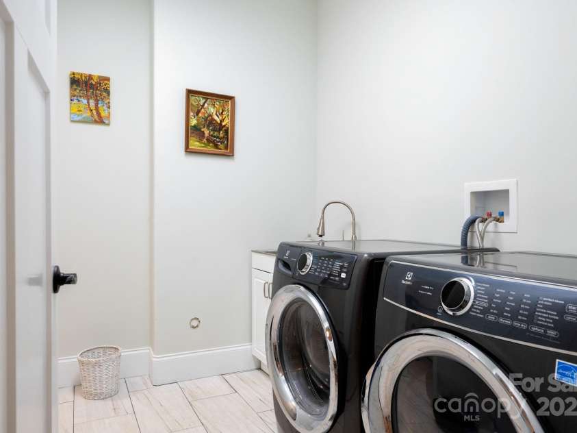 33 Penley Park Drive, Weaverville, NC 28787.  MLS# CAR4286490, YatesRealty ID 33176. A well-placed laundry room sits just off the kitchen and near the garage entry.