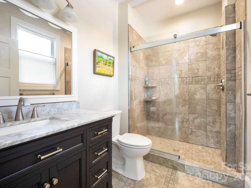 33 Penley Park Drive, Weaverville, NC 28787.  MLS# CAR4286490, YatesRealty ID 33176. Full bathroom in secondary ensuite bedroom.