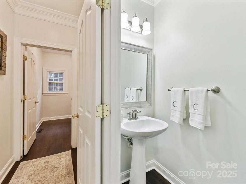 4032 Cambridge Hill Lane, Charlotte, NC 28270.  MLS# CAR4277573, YatesRealty ID 33179. Downstairs powder room
