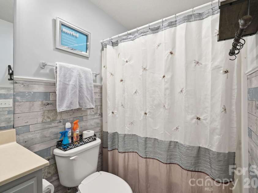 83 Sunny Meadows Boulevard, Arden, NC 28704.  MLS# CAR4396781, YatesRealty ID 33187. Guest bathroom