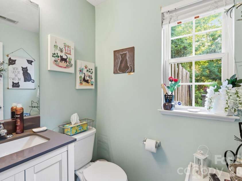 83 Sunny Meadows Boulevard, Arden, NC 28704.  MLS# CAR4396781, YatesRealty ID 33187. Main level half bath